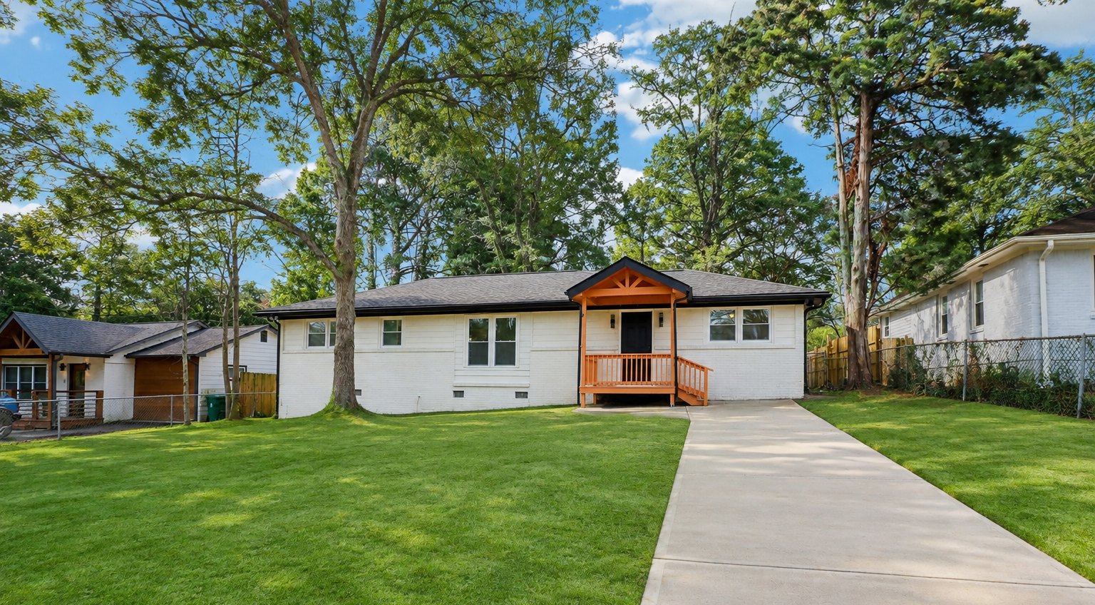 Renovated single-family house with lawn and driveway
